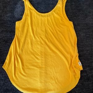Victoria secret tanks by PINK. Both large. One is dark red and one is yellow.